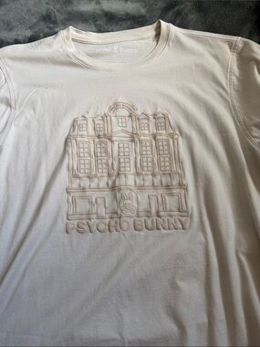 Psycho Bunny Embossed Front Logo Tee in Cream